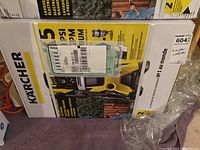 Front of sealed original box showing Kärcher logo, unit image and shipping labels