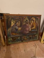 Full view of the framed painting showing three men in hats seated on a bench outdoors with trees behind them.