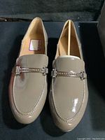 Aerosoles Bone Meteorite patent leather loafer pair front view showing beige color and silver hardware detail