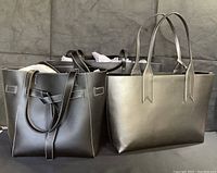 Three tote handbags arranged side by side, showing front and texture of bags.