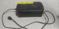 Full view of APC Back-UPS ES 350 UPS unit with attached power cord.