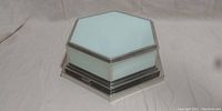 Full top and front view of the hexagonal ceiling light fixture showing frosted glass panels and metal frame.