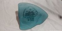 View of the paperweight showing etched Eskimos