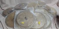 Photo showing multiple bongo heads stacked and wrapped in plastic, some with visible yellow price tags