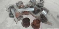 Image of 16 mini wood containers individually bagged, showing dark and light wood pieces