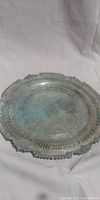 Full view of round electroplated copper tray showing overall condition and patina.