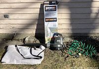 Full lot of garden cleaning equipment including blower, hose, bag and boxed gutter cleaning attachment
