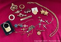 Full assortment of jewelry pieces displayed on red background