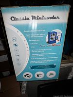 Photo of the packaging box showing features and specifications of the Classic Mini Cooler car refrigerator.
