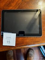 Samsung tablet shown from the front, displaying the screen, bezel, and front camera.