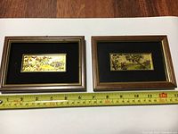 Two mini Italian 23k gold foil serigraphs in wooden frames, showing full view with measuring tape indicating about 6.5 inches width and 4.5 inches height