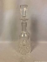 Full view of the Waterford crystal decanter with stopper, showing the overall shape and design.