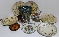 Photo showing entire lot including hand-painted giraffe and deer plates, amber carnival glass compote, ceramic pitcher, carousel horse figurine, and smaller decorative items.