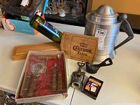 Overall lot showing Corona Extra wine holder, boxed wooden-handled bar tools, golf-themed metal ice bucket, and two metal bottle openers including pipe-shaped one.
