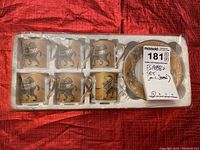 Yamasen 24ct gold plated espresso cups and matching saucers in original white molded packing with plastic cover over them showing some wear.