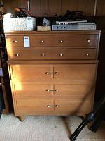 Front view of two-tier ash dresser showing four upper drawers and two lower drawers