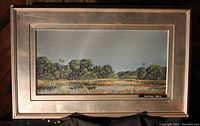 Framed painting 'Quiet Waters' by Robert Binks showing full frontal view in silver gilt wood frame