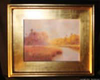 Framed acrylic painting by Robert Binks showing a soft, impressionistic landscape with a river, in gold-tone frame and mat.