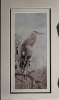 Matted bird print showing a heron in natural grassland setting