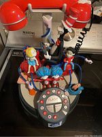 Full view of Cat In The Hat novelty phone showing all characters and rotary style keypad on circular base.