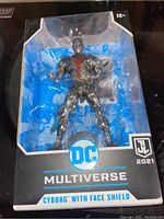 Photo of DC Multiverse Cyborg figure in original box with clear plastic front showing the figure clearly.