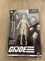 GI Joe Classified Series Storm Shadow action figure in original unopened packaging with two swords visible as accessories.