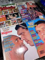 Photo showing four wrestling magazines including two WWF Magazines and one The Best of The Wrestler magazine, all featuring Andre The Giant or wrestling content on the covers.