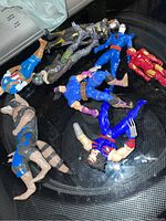 Photo of nine Marvel and Toy Biz action figures from the 90s and newer including heroes and villains.