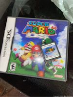 Photo of Super Mario 64 DS game cartridge inside its original case for Nintendo DS.