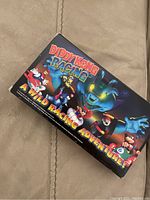 Photo of a VHS tape case with the colorful cover of Diddy Kong Racing, showing characters and title text.