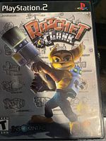 Front cover of Ratchet & Clank game for PlayStation 2, showing title, characters, ESRB rating Teen, and PlayStation 2 branding.