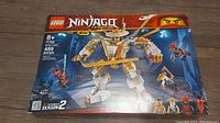 Front of the LEGO Ninjago Legacy 71702 box showing the completed White Dragon Master Mech with four minifigures and 489 pieces.