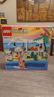 Front of LEGO System 6411 box showing Paradisa Café illustration and age and piece count