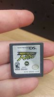 Close-up photo of the Nintendo DS game cartridge for Need for Speed Nitro showing the label and rating.