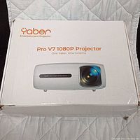 Closed original box showing Yaber Pro V7 1080P Projector branding and image of the projector.