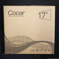 Photo of one sealed box with Cocar branding showing 17 inch CCTV LED monitor, sealed in factory packaging.