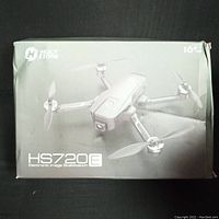 Box showing Holy Stone HS720E model drone with electronic image stabilization, suitable for age 16+. Box has some wear and tear.