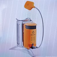 Assembled BioLite CampStove 2+ connected to its LED FlexLight on white background