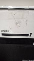 Sealed white retail box labeled Bose Smart Soundbar 300 with printed image of soundbar and remote