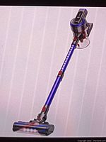Fully assembled cordless stick vacuum displayed upright