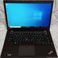 Front view of open Lenovo ThinkPad T450s showing display, keyboard and trackpad