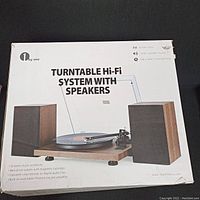 Box of the 1byone Turntable Hi-Fi System with speakers showing product information and features.