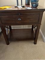 Front view of nightstand showing drawer and lower shelf