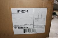 Box label showing model M10035SD by Meridian Lighting with silver dust finish and a trestle light design illustration.