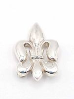 Front view of polished sterling silver Fleur de Lis brooch showing smooth curved design and hallmark on the front surface.