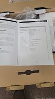 Photo of the product manual showing technical parameters and product features for household oxygen bar device.