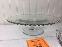 Imperial Candlewick glass cake stand showing pedestal base and beaded edge detail