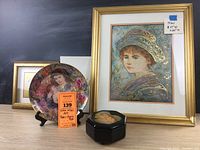 Entire collection including the framed print, decorative plate on stand, smaller framed artwork, and music box.