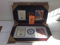 Photo showing both Navy and Marine Corps wooden frames side by side in cardboard packaging, highlighting their dimensions and layout.