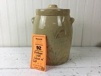 Full view of the vintage crock with lid, showing its shape, color, and condition.